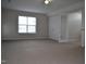 Spacious bedroom with carpet, featuring double closet doors and a window offering ample lighting at 136 Wedgewood Ct, Sanford, NC 27332