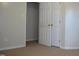 Neutral bedroom with carpet, standard base trim, and featuring a closet with standard doors at 136 Wedgewood Ct, Sanford, NC 27332