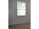Bedroom featuring neutral walls and carpet, with a window providing natural light at 136 Wedgewood Ct, Sanford, NC 27332