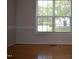 Bright dining room features wood floors and a large window with natural light at 136 Wedgewood Ct, Sanford, NC 27332