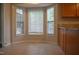 Bright kitchen nook with bay windows, neutral walls, and tiled floors at 136 Wedgewood Ct, Sanford, NC 27332