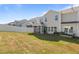 Back exterior of the home with screened porch and fenced backyard at 1414 Arena Ln, Fuquay Varina, NC 27526