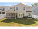 Back exterior of the home with screened porch and fenced backyard at 1414 Arena Ln, Fuquay Varina, NC 27526