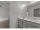Bathroom featuring double sinks with modern vanities, a large mirror, and neutral colors at 1414 Arena Ln, Fuquay Varina, NC 27526