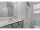 Clean bathroom with grey vanity, modern faucet, framed mirror, and updated fixtures at 1414 Arena Ln, Fuquay Varina, NC 27526