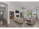 Spacious living room with fireplace, built-in bookshelves, large windows and hardwood floors throughout at 1414 Arena Ln, Fuquay Varina, NC 27526