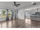 Bright living room featuring hardwood floors, ample natural light, and an open layout at 1414 Arena Ln, Fuquay Varina, NC 27526