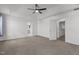 Spacious main bedroom with neutral carpet and doors leading to bathroom and closet at 1414 Arena Ln, Fuquay Varina, NC 27526
