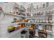 Organized pantry featuring wire shelves stocked with a variety of food items and storage containers at 1414 Arena Ln, Fuquay Varina, NC 27526