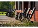 Covered porch with rocking chairs offers a relaxing outdoor space to enjoy the beautiful surroundings at 152 Serene Xing, Fuquay Varina, NC 27526
