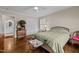 Bedroom featuring hardwood floors, a closet, and neutral paint at 1732 Edgewood Ave, Burlington, NC 27215