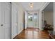 Inviting foyer with hardwood floors, closet, and natural light streaming through the front door at 1732 Edgewood Ave, Burlington, NC 27215