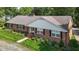 Charming brick home featuring manicured lawn, black shutters, and a welcoming front entrance at 1732 Edgewood Ave, Burlington, NC 27215