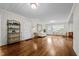 Bright and airy living room showcases hardwood floors, neutral colors and lots of natural light at 1732 Edgewood Ave, Burlington, NC 27215