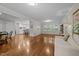 Bright living room with hardwood floors, neutral paint, and an open floor plan to the kitchen at 1732 Edgewood Ave, Burlington, NC 27215
