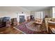Spacious living room showcasing hardwood floors, a fireplace, and seamless flow to other living areas at 1732 Edgewood Ave, Burlington, NC 27215