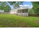 Well-maintained backyard with a screened-in porch, perfect for outdoor enjoyment at 178 Palmer Dr, Clayton, NC 27527