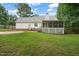 Exterior view featuring a well-maintained backyard with a screen porch at 178 Palmer Dr, Clayton, NC 27527