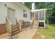 Exterior view showcasing backyard access from the door and screened-in porch at 178 Palmer Dr, Clayton, NC 27527