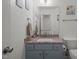 Charming half bathroom with a granite countertop and nautical decor at 178 Palmer Dr, Clayton, NC 27527