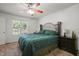 Comfortable bedroom with a queen-sized bed, ceiling fan, and carpeted floors at 178 Palmer Dr, Clayton, NC 27527