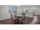 Cozy dining area features a glass table, seating for four, and natural light at 178 Palmer Dr, Clayton, NC 27527