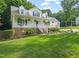 Beautiful two-story home with a welcoming front porch and lush landscaping at 178 Palmer Dr, Clayton, NC 27527