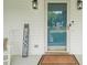 Welcoming front door with a charming welcome sign and a view of the neighborhood at 178 Palmer Dr, Clayton, NC 27527