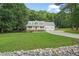 Charming home featuring a manicured lawn, two-car garage, and inviting front porch at 178 Palmer Dr, Clayton, NC 27527