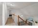 Hallway with white walls and carpeted floors that leads to a living room and a bedroom at 178 Palmer Dr, Clayton, NC 27527