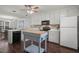 Spacious kitchen features stainless steel appliances, white cabinets, and central island at 178 Palmer Dr, Clayton, NC 27527