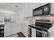 Elegant kitchen featuring stainless steel appliances, sleek countertops, and fixtures at 178 Palmer Dr, Clayton, NC 27527
