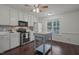 Modern kitchen with white cabinets, updated appliances, and central island at 178 Palmer Dr, Clayton, NC 27527