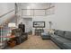 Spacious living room featuring high ceilings, a staircase, and comfortable seating at 178 Palmer Dr, Clayton, NC 27527