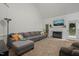 Large living room with a fireplace, comfortable seating, and ample natural light at 178 Palmer Dr, Clayton, NC 27527