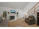 Inviting living room with a fireplace, plush seating, and plenty of natural light at 178 Palmer Dr, Clayton, NC 27527