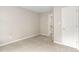 Neutral bedroom featuring plush carpeting, fresh paint, and ample closet space at 2 Lake Village Dr, Durham, NC 27713
