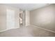 Neutral bedroom featuring plush carpeting, fresh paint, and ample closet space at 2 Lake Village Dr, Durham, NC 27713