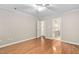 A bedroom featuring hardwood floors, neutral paint, and an ensuite bathroom at 2 Lake Village Dr, Durham, NC 27713