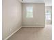 Cozy bedroom with carpet flooring, and bright windows at 2 Lake Village Dr, Durham, NC 27713
