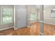 Welcoming foyer featuring hardwood floors and windows offering natural light at 2 Lake Village Dr, Durham, NC 27713