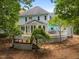 Landscaped backyard with a two-level deck, mature trees, and plenty of space for outdoor enjoyment at 200 Frenchmans Bluff Dr, Cary, NC 27513