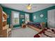 Bedroom features a ceiling fan, two windows with shutters and hardwood desk at 200 Frenchmans Bluff Dr, Cary, NC 27513
