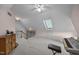 Spacious bonus room featuring vaulted ceilings, a skylight, plush carpeting and plenty of natural light at 200 Frenchmans Bluff Dr, Cary, NC 27513