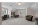 Bonus room featuring natural light from the windows, a built-in book shelf and chair at 200 Frenchmans Bluff Dr, Cary, NC 27513