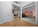 Spacious foyer with hardwood floors, leading to various rooms and a staircase visible in the background at 200 Frenchmans Bluff Dr, Cary, NC 27513