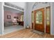 Charming foyer with hardwood floors, a decorative front door, and a glimpse into a cozy living space at 200 Frenchmans Bluff Dr, Cary, NC 27513