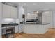 Beautiful kitchen featuring granite countertops, island, and built-in desk area at 200 Frenchmans Bluff Dr, Cary, NC 27513
