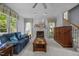 Cozy living room features a fireplace, neutral carpet, and bright windows at 200 Frenchmans Bluff Dr, Cary, NC 27513