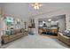 Inviting living room open to kitchen features cozy seating and plenty of natural light at 200 Frenchmans Bluff Dr, Cary, NC 27513